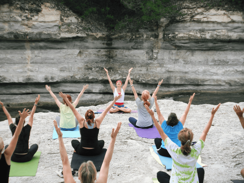 a group of people seated with their arms up | National Social Anxiety Center