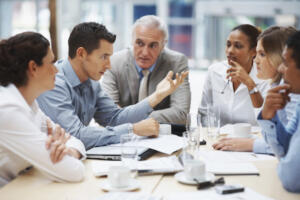 a group talking around a table